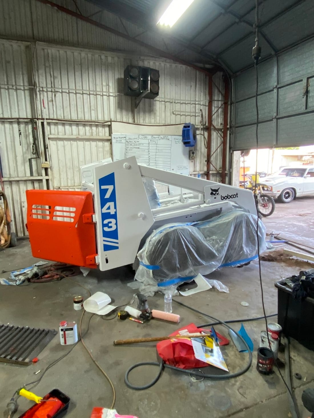 Bobcat skid-steer being restored in the workshop