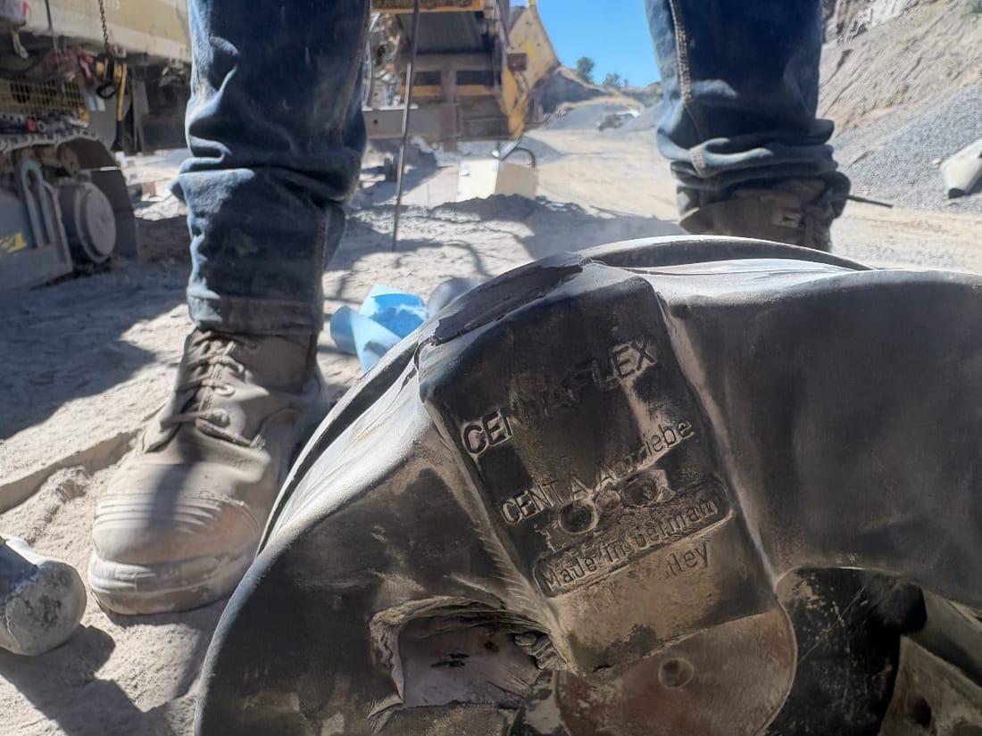 Damaged rubber drive coupling element on the ground