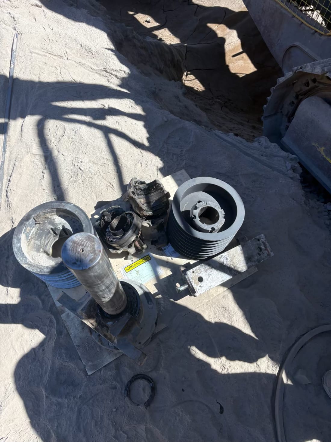 Crusher drive parts laid out on site