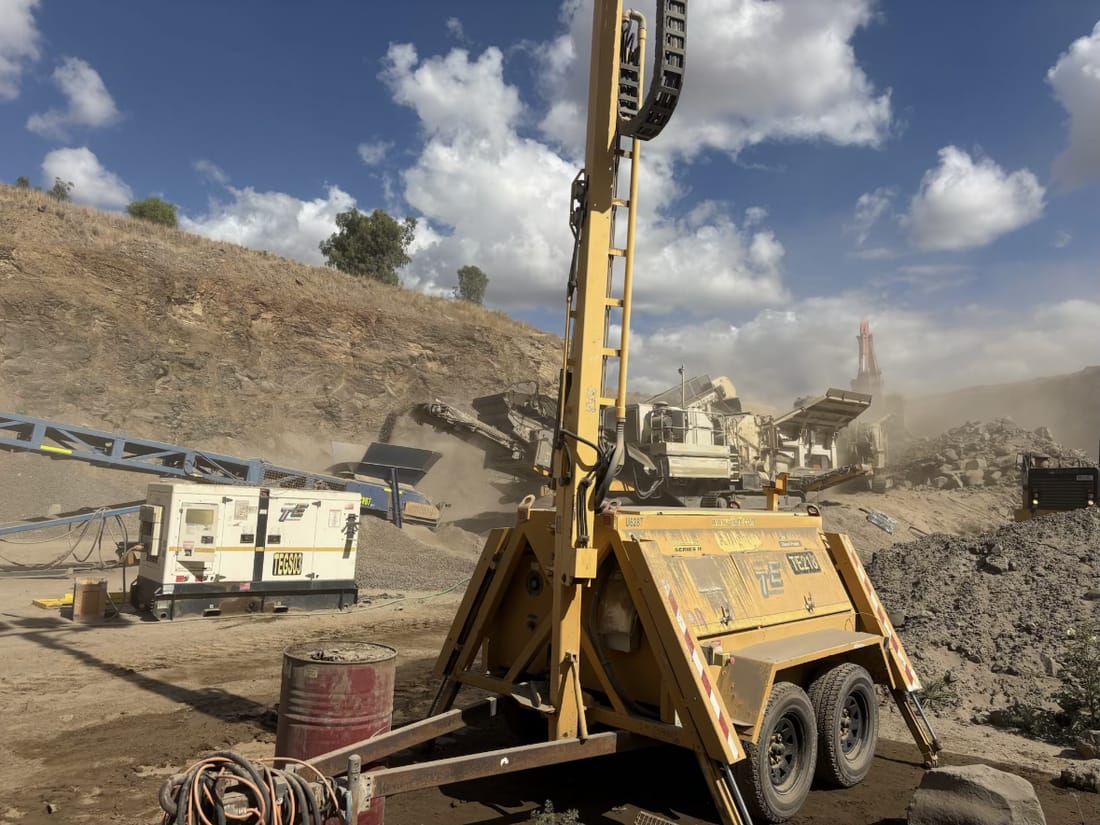 Light tower and crushing plant at a quarry