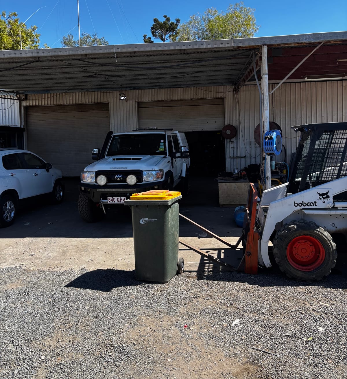 Workshop yard at Blackwater with ute and Bobcat